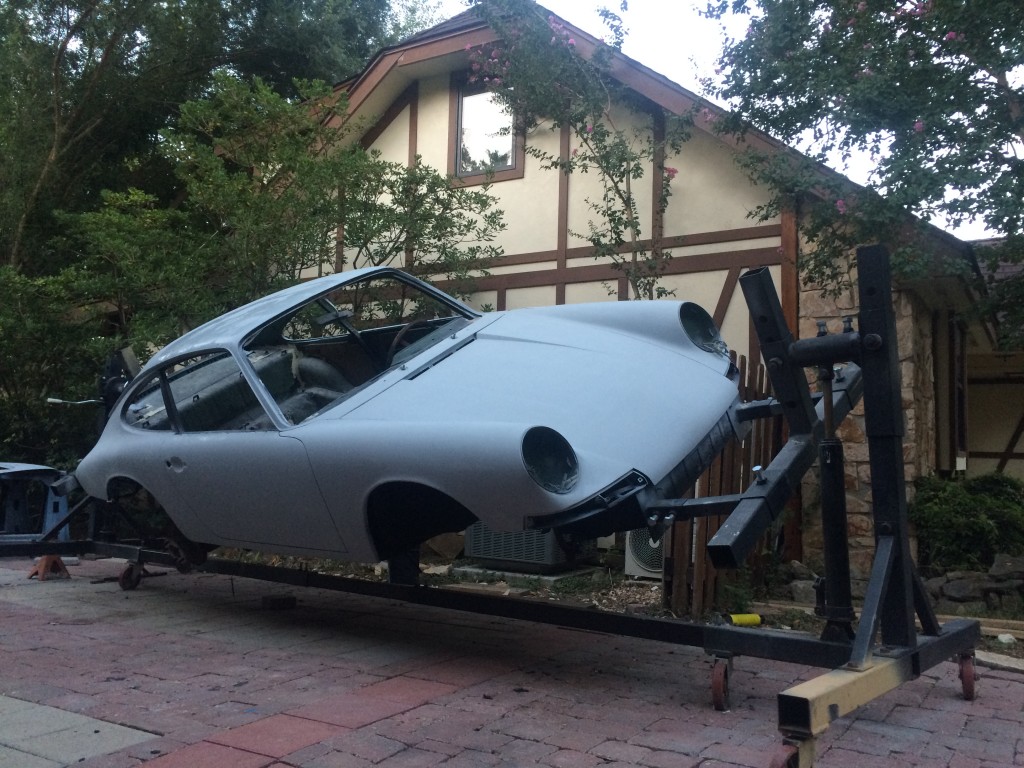 Porsche 911 on the rotisserie for chassis restoration.